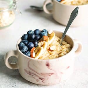 Close,Up,Of,Bowls,With,Oatmeal,Porridge,With,Blueberries,For