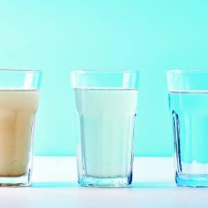 Water,Filters.,Concept,Of,Three,Glasses,On,A,White,Blue