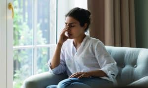 Depressed,Frustrated,Young,Indian,Woman,Suffering,From,Headache,,Migraine,,Touching